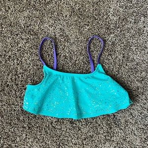 This is a kid bathing suit that includes sequence on the bathing suit top!